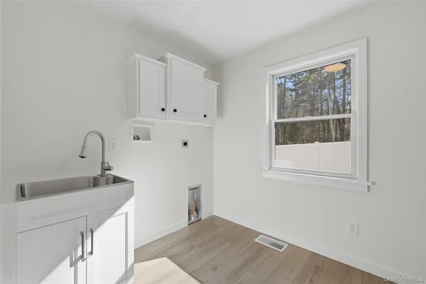 a bathroom with a sink and a window