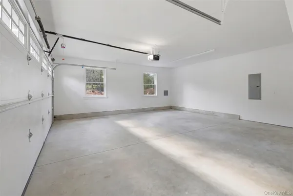 a view of a big room with windows and fireplace