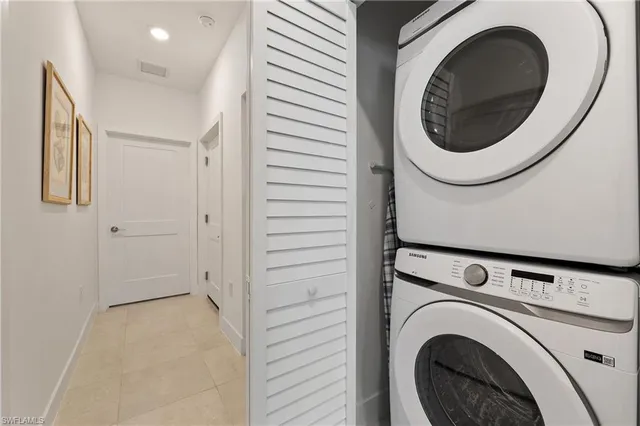 a view of a hallway with washer and dryer
