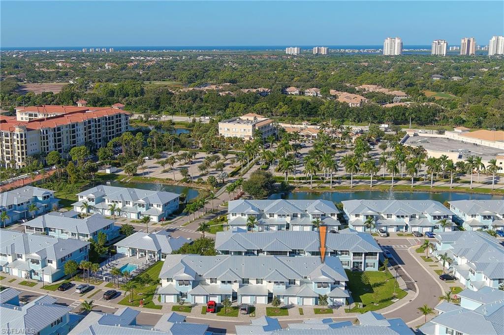 26401 Coco Cay Circle, Unit 101 Bonita Springs, FL 34135 - Photo 2 of 27 an aerial view of residential building and lake