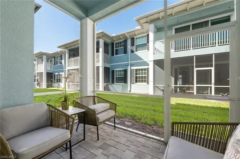 a view of a house with a backyard and porch