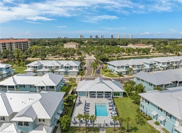 an aerial view of residential houses with outdoor space
