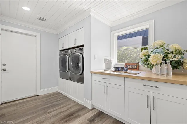 a kitchen with sink and cabinets
