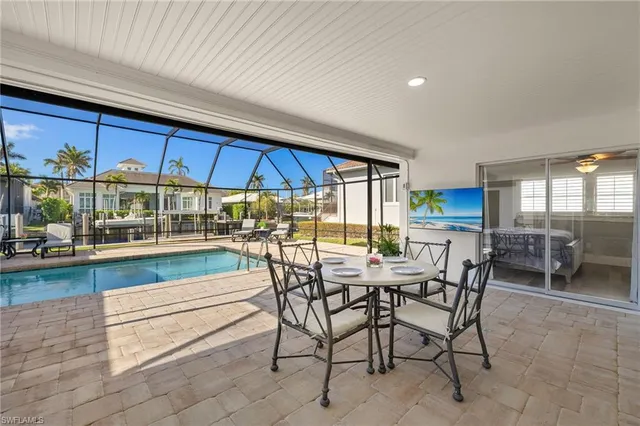 a view of a dining area with furniture and chandelier