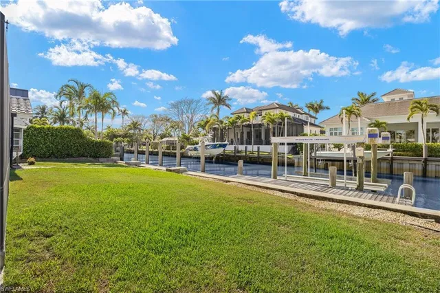 a view of a swimming pool with a garden and trees