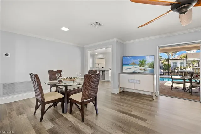 a view of a dining room with furniture and a wooden floor