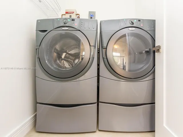 a utility room with dryer and washer