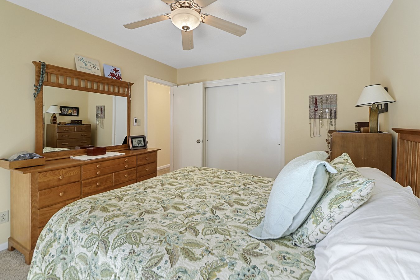 1725 Robert Drive Champaign, IL 61821 - Photo 13 of 18 a bedroom with a large bed and a dresser