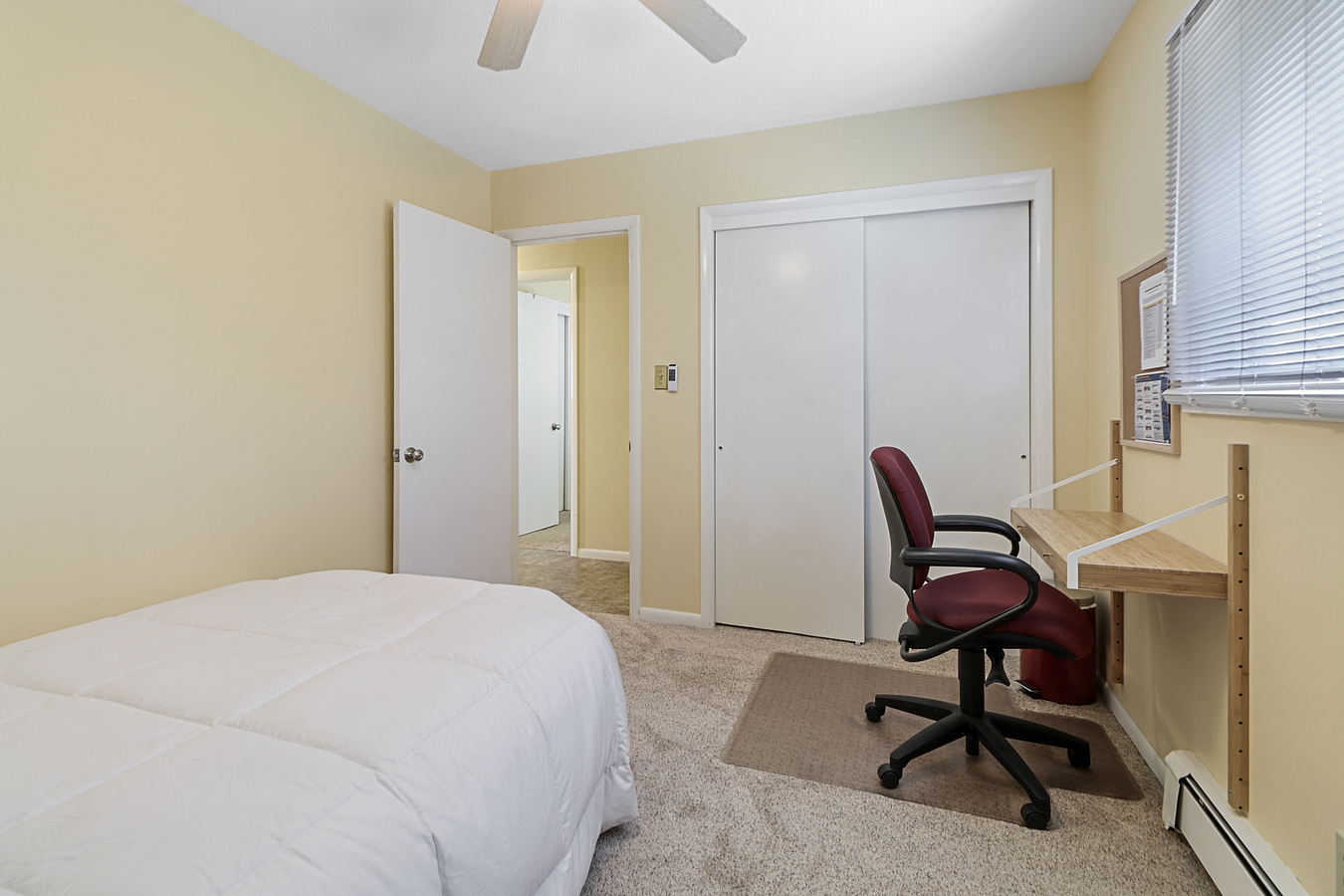 1725 Robert Drive Champaign, IL 61821 - Photo 15 of 18 a view of a workspace with furniture and a window