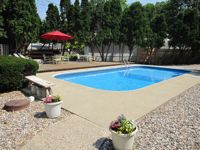 1725 Robert Drive Champaign, IL 61821 - Photo 3 of 18 a view of a swimming pool with a patio