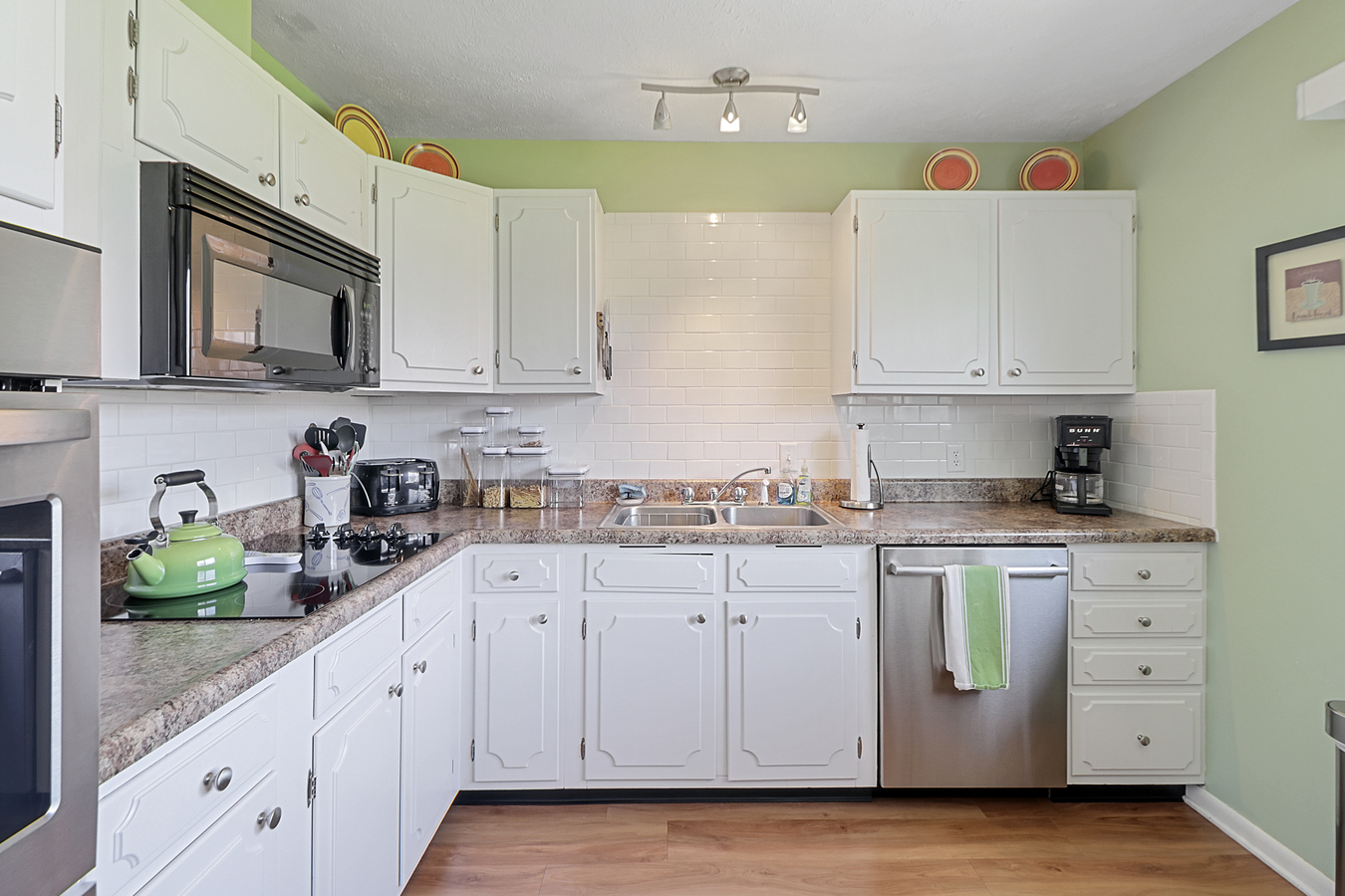 1725 Robert Drive Champaign, IL 61821 - Photo 10 of 18 a kitchen with white cabinets and white appliances