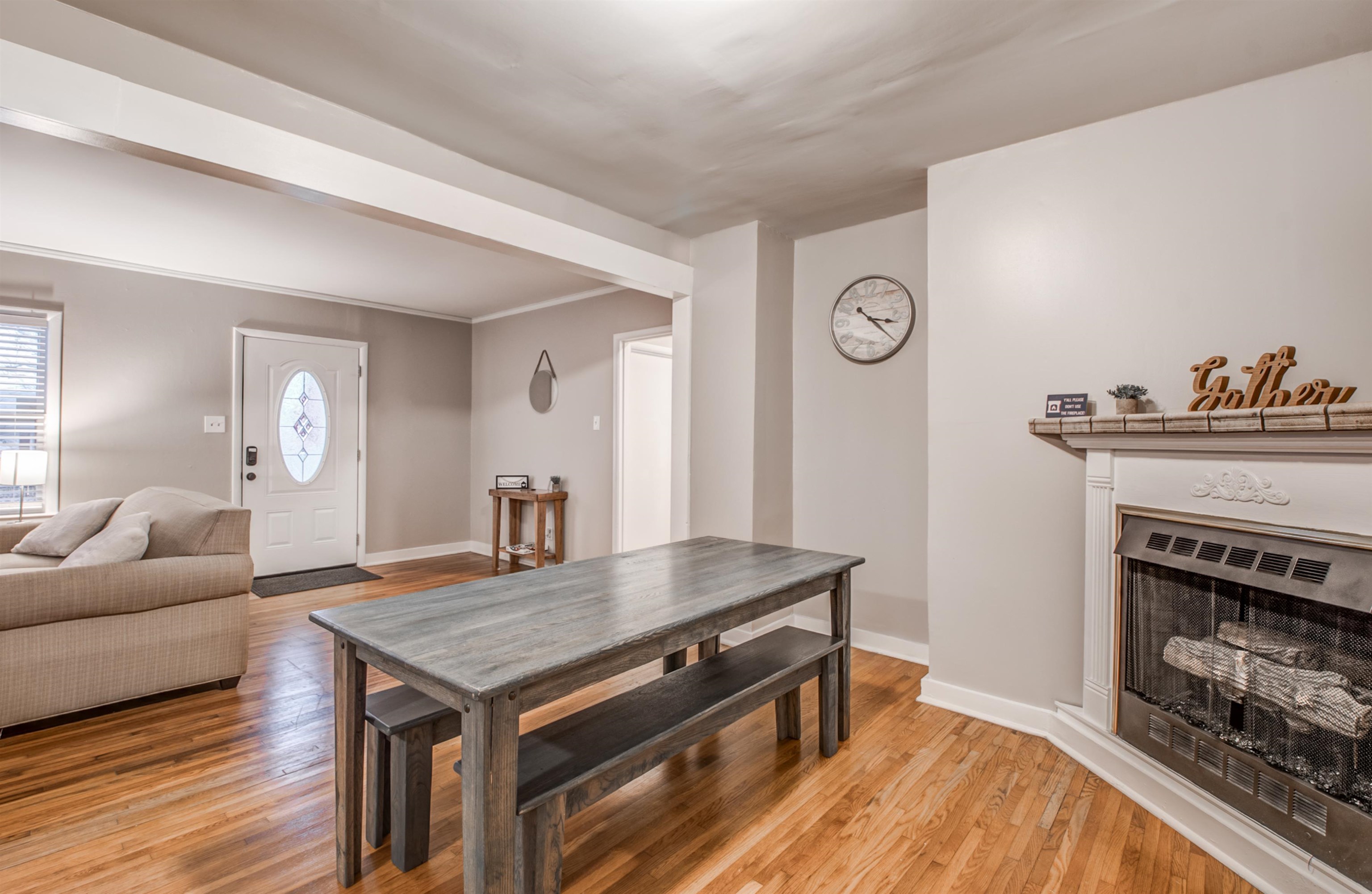 4850 Flamingo Road Memphis, TN 38117 - Photo 13 of 40 Dining area featuring a fireplace, light wood-style floors, and ornamental molding