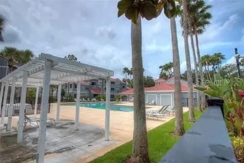 a front view of multi story residential apartment building with yard