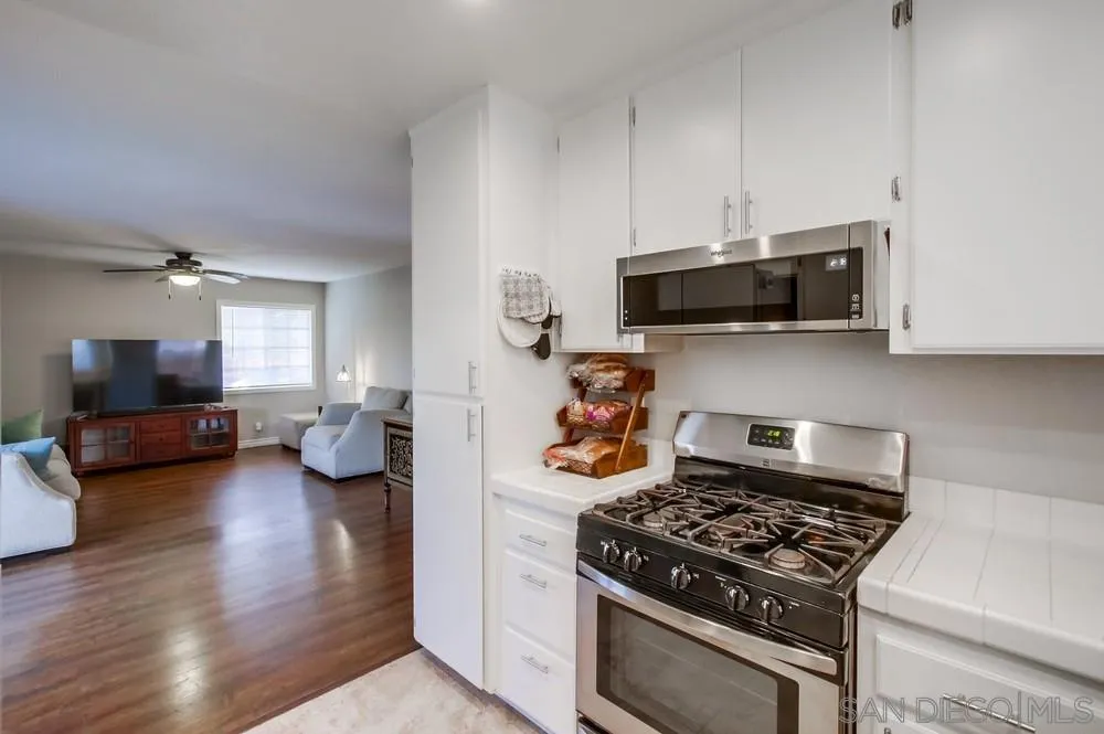 898 Friendly Circle El Cajon, CA 92021 - Photo 17 of 38 a kitchen with a stove and a microwave