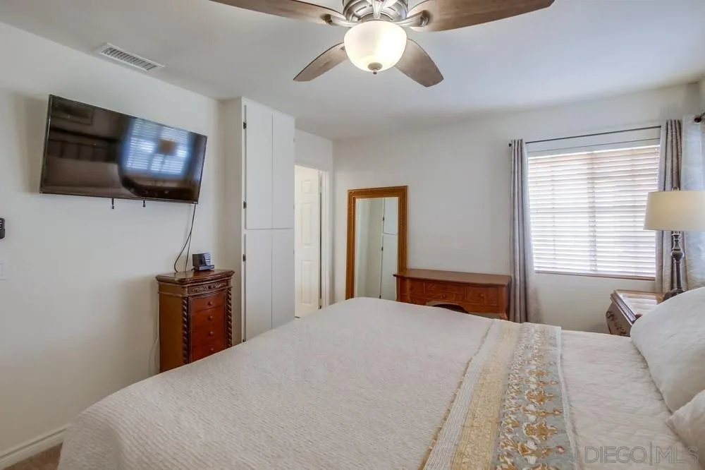 898 Friendly Circle El Cajon, CA 92021 - Photo 20 of 38 a bedroom with a bed and a flat screen tv