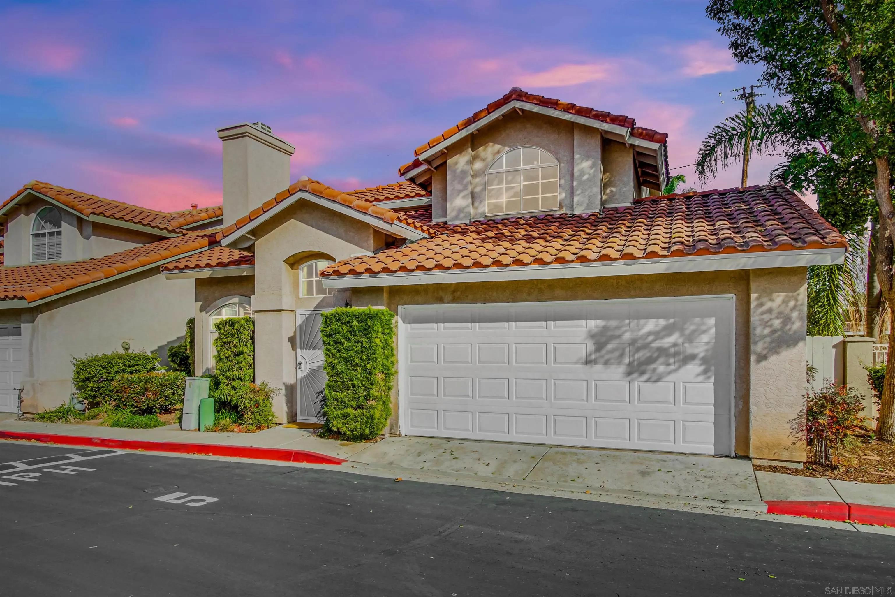 898 Friendly Circle El Cajon, CA 92021 - Photo 2 of 38 a front view of a house with a yard and garage