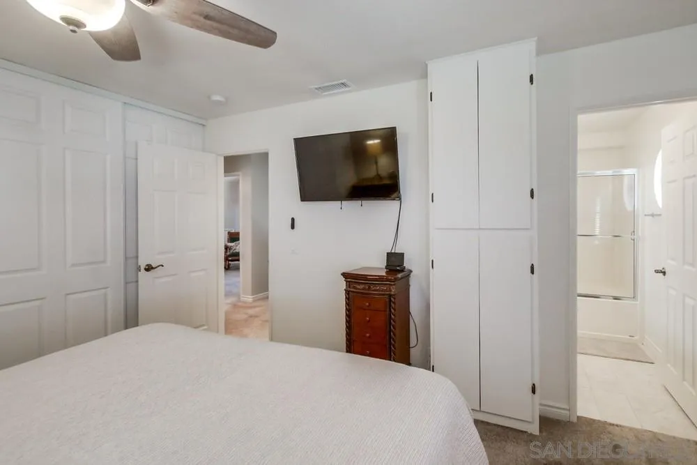 898 Friendly Circle El Cajon, CA 92021 - Photo 22 of 38 a bedroom with a bed and a flat screen tv