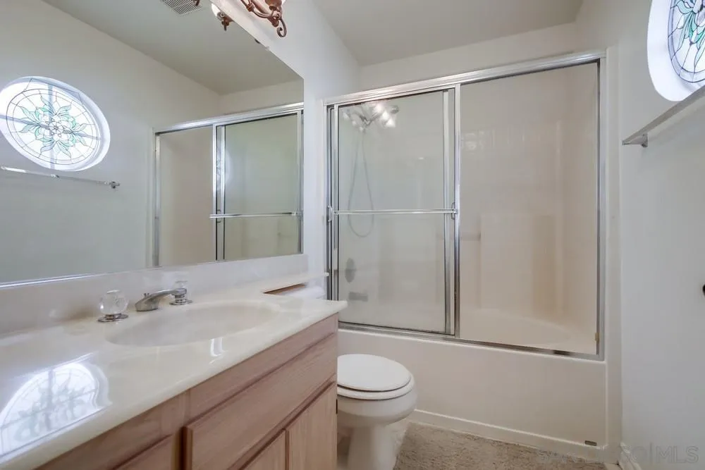 898 Friendly Circle El Cajon, CA 92021 - Photo 23 of 38 a bathroom with a sink a toilet and shower