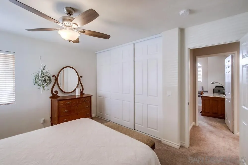 898 Friendly Circle El Cajon, CA 92021 - Photo 29 of 38 a bedroom with a bed and a chandelier