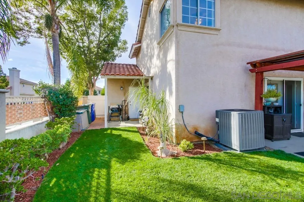 898 Friendly Circle El Cajon, CA 92021 - Photo 35 of 38 a view of an house with backyard space and a tree