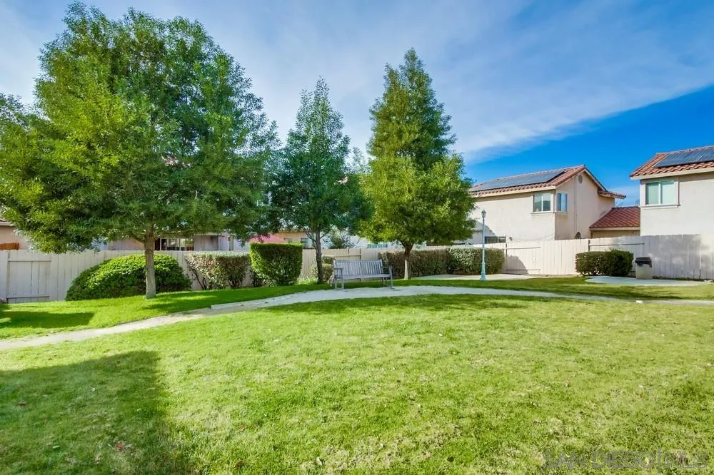 898 Friendly Circle El Cajon, CA 92021 - Photo 38 of 38 a front view of a house with a yard and trees