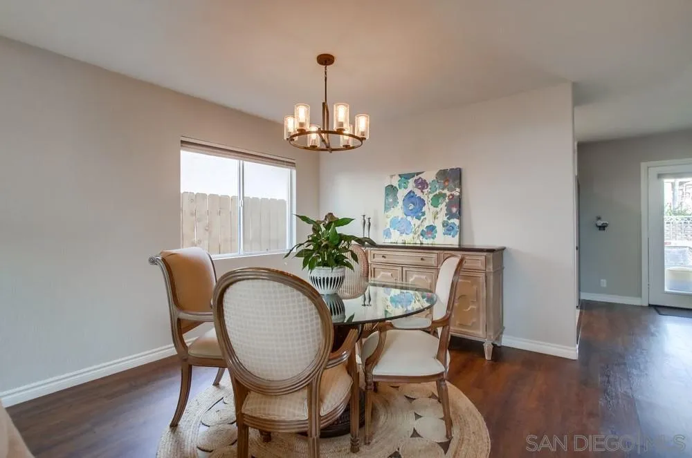 898 Friendly Circle El Cajon, CA 92021 - Photo 7 of 38 a dining room with furniture a chandelier and wooden floor