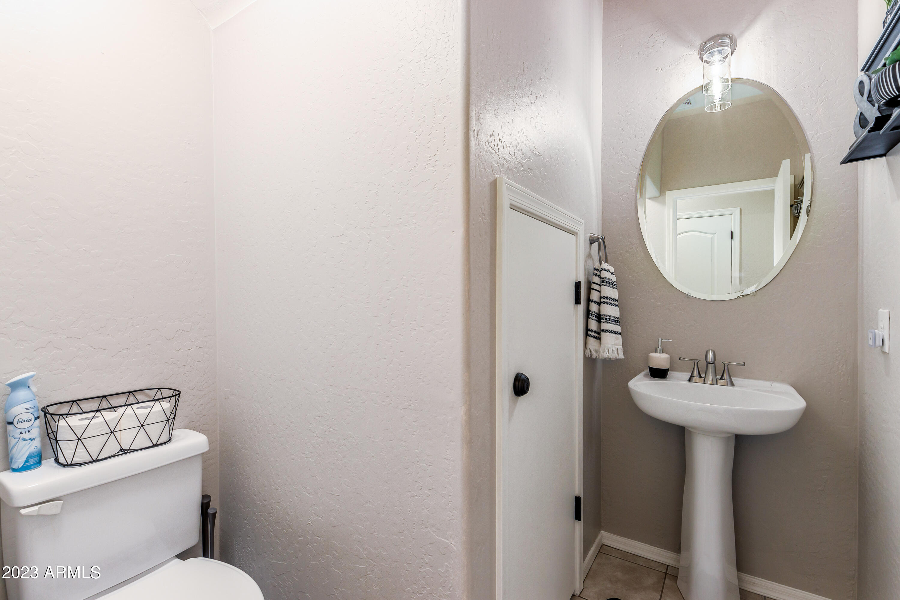 5415 East McKellips Road, Unit 93 Mesa, AZ 85215 - Photo 11 of 64 a bathroom with a toilet sink and mirror