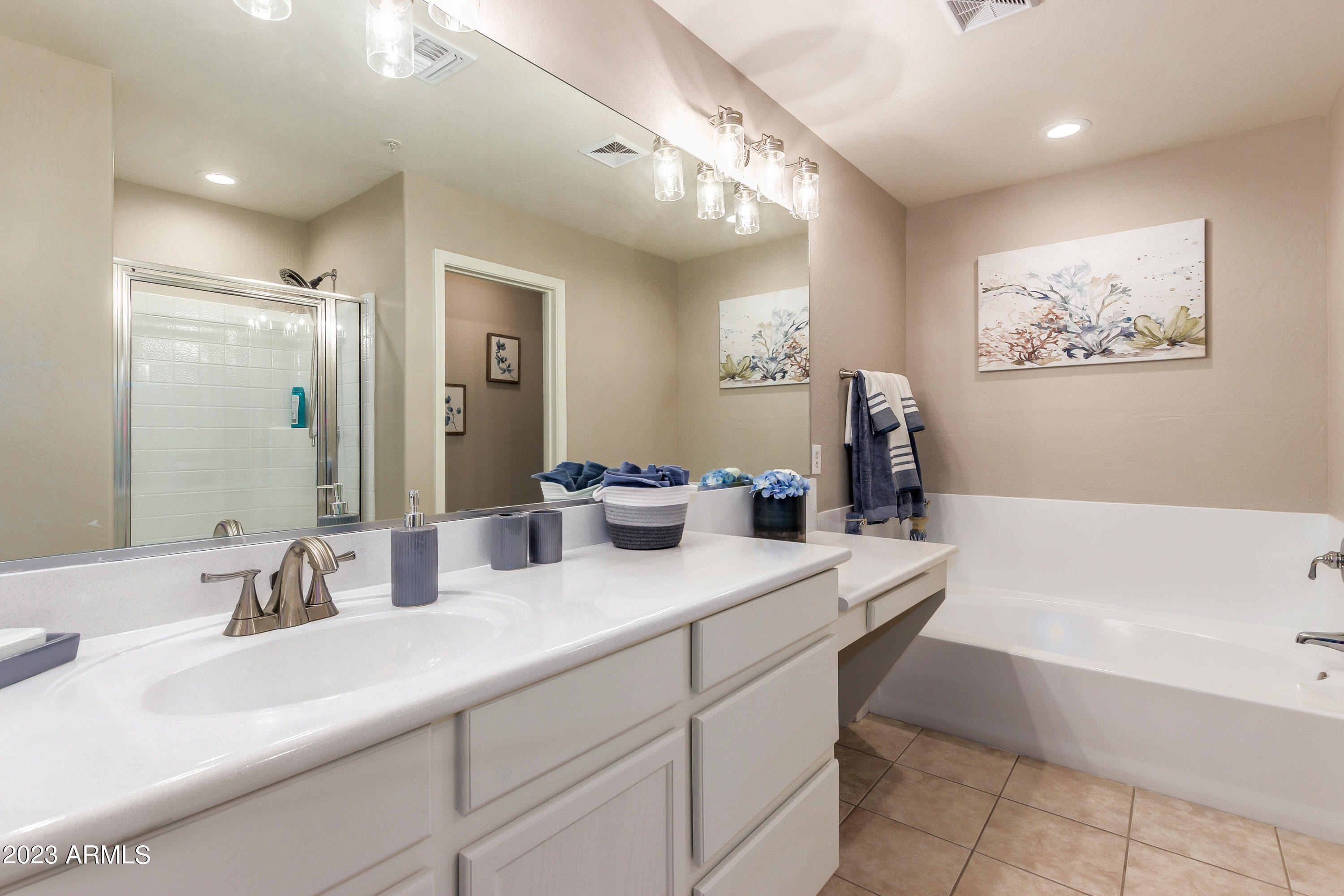 5415 East McKellips Road, Unit 93 Mesa, AZ 85215 - Photo 19 of 64 a bathroom with a tub sink and mirror