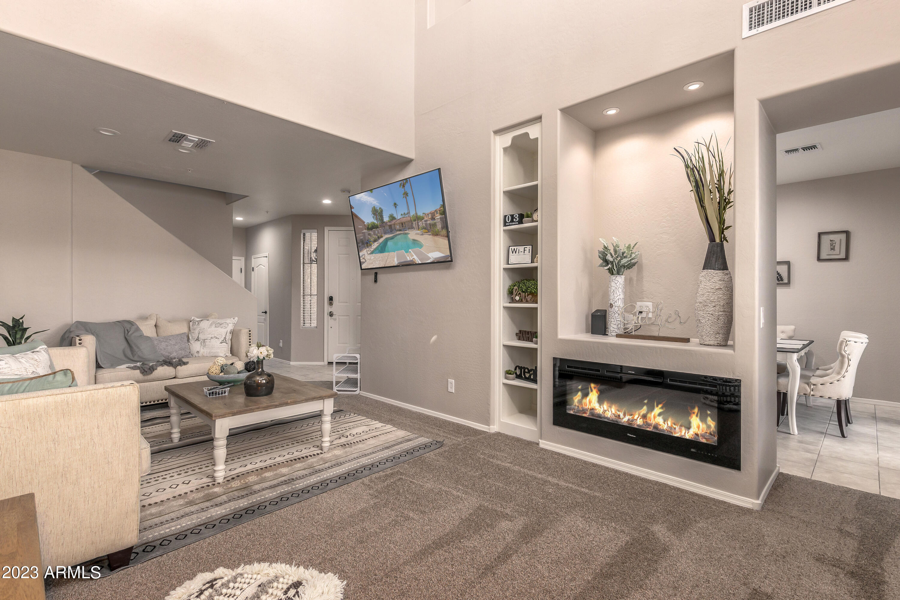 5415 East McKellips Road, Unit 93 Mesa, AZ 85215 - Photo 4 of 64 a living room with furniture a window and a fireplace