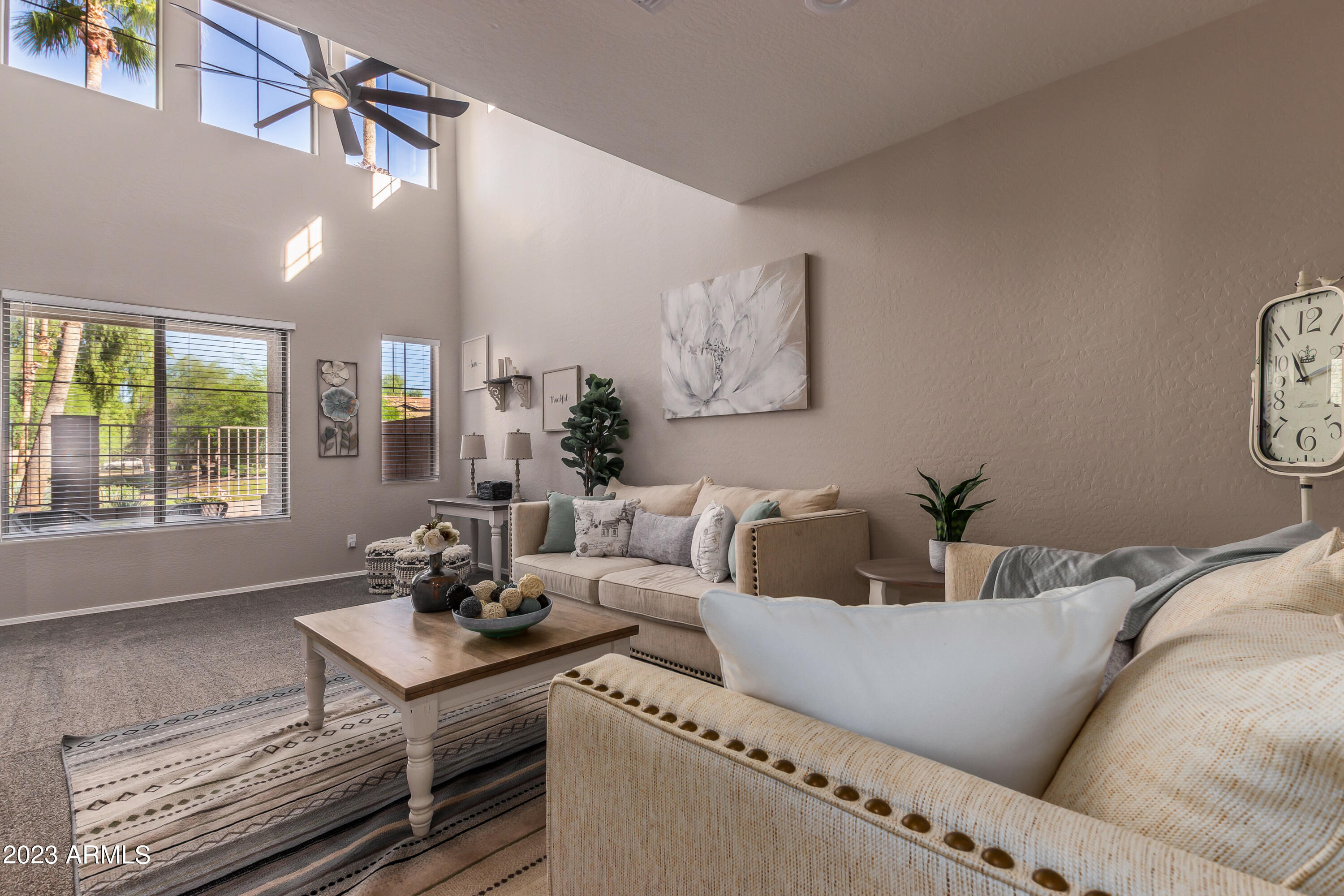 5415 East McKellips Road, Unit 93 Mesa, AZ 85215 - Photo 5 of 64 a living room with furniture and a large window