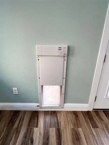a view of a hallway with wooden floor and a fireplace