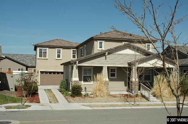10587 Bliss Court Reno, NV 89521 - Photo 2 of 9 a front view of a house with a yard garage and outdoor seating