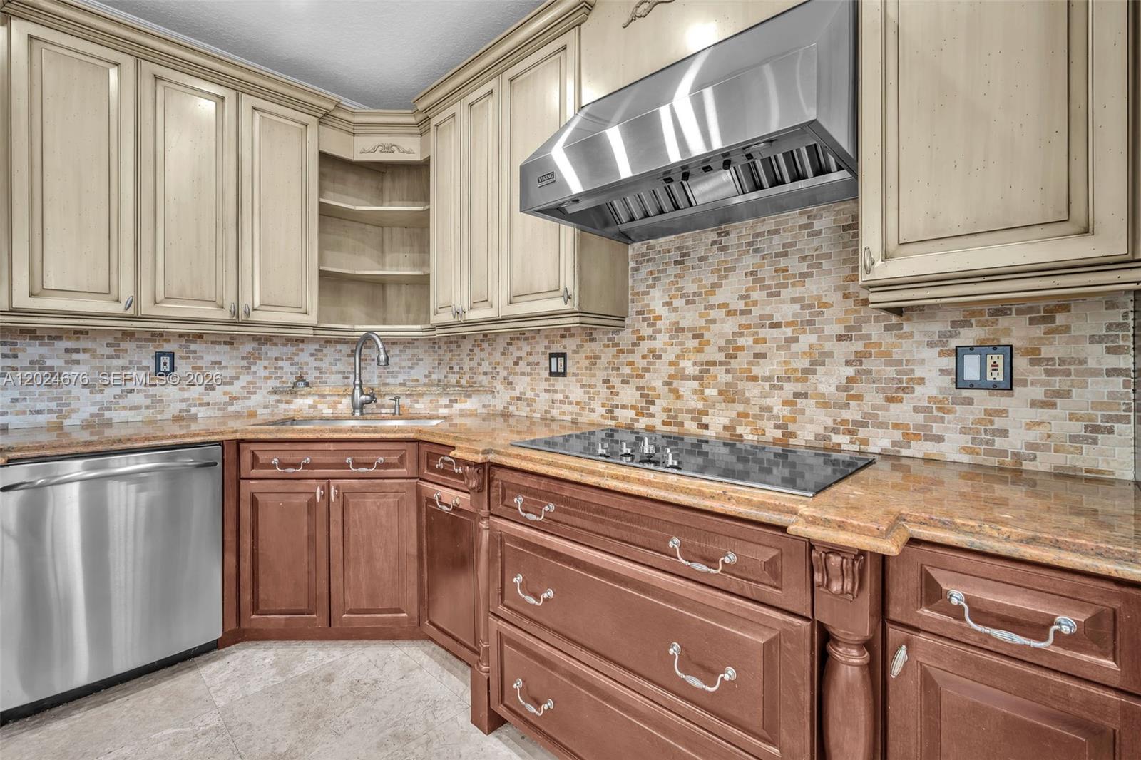 2155 Southwest 156th Court Miami, FL 33185 - Photo 26 of 57 a kitchen with stainless steel appliances granite countertop a sink a stove and cabinets