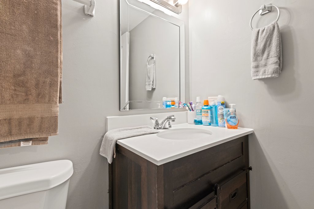 9830 Sayre Avenue, Unit 6 Chicago Ridge, IL 60415 - Photo 16 of 25 a bathroom with a sink vanity and a toilet