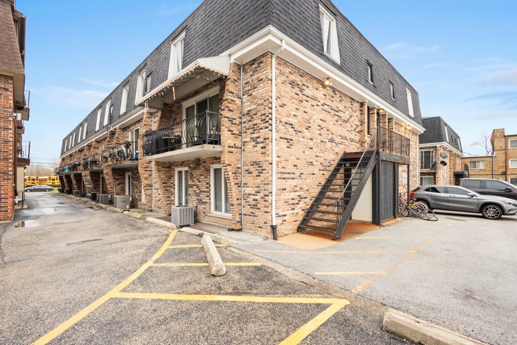 9830 Sayre Avenue, Unit 6 Chicago Ridge, IL 60415 - Photo 23 of 25 a view of a building with many windows