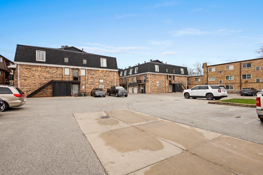 9830 Sayre Avenue, Unit 6 Chicago Ridge, IL 60415 - Photo 24 of 25 a view of building with cars parked
