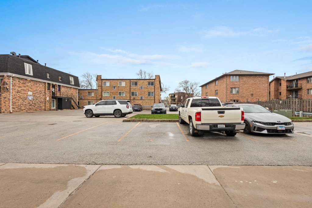 9830 Sayre Avenue, Unit 6 Chicago Ridge, IL 60415 - Photo 25 of 25 a view of cars parked in front of a house