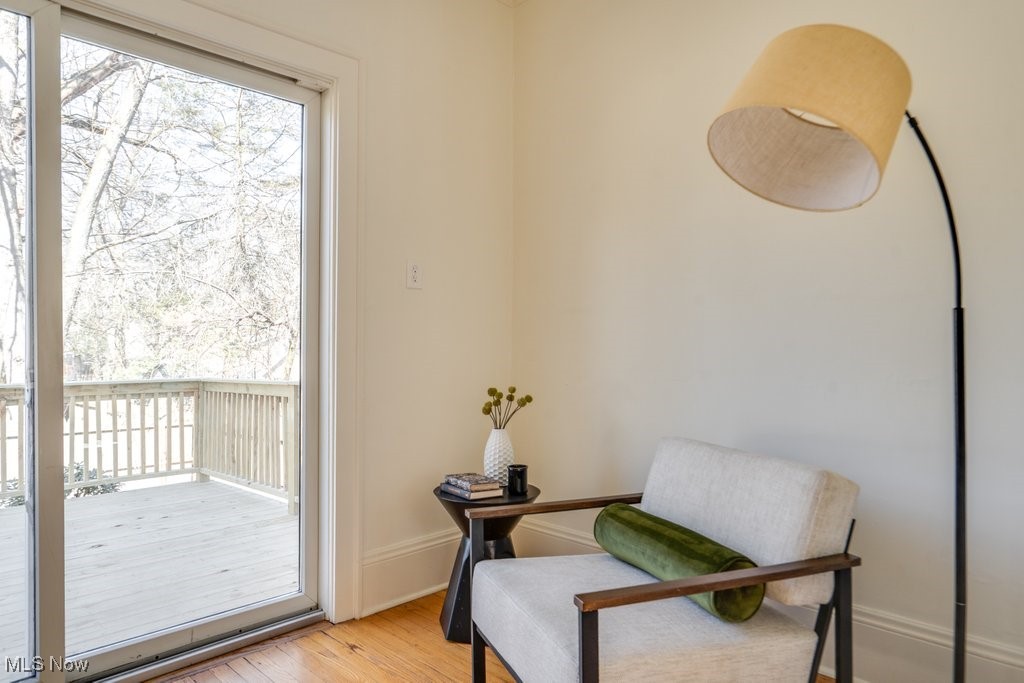 199 Edgerton Road Akron, OH 44303 - Photo 25 of 49 Living area featuring baseboards, plenty of natural light, and light wood finished floors