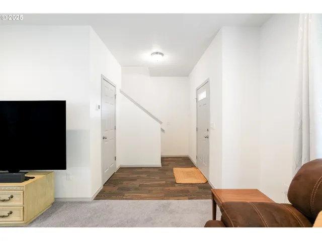 a view of entryway with wooden floor