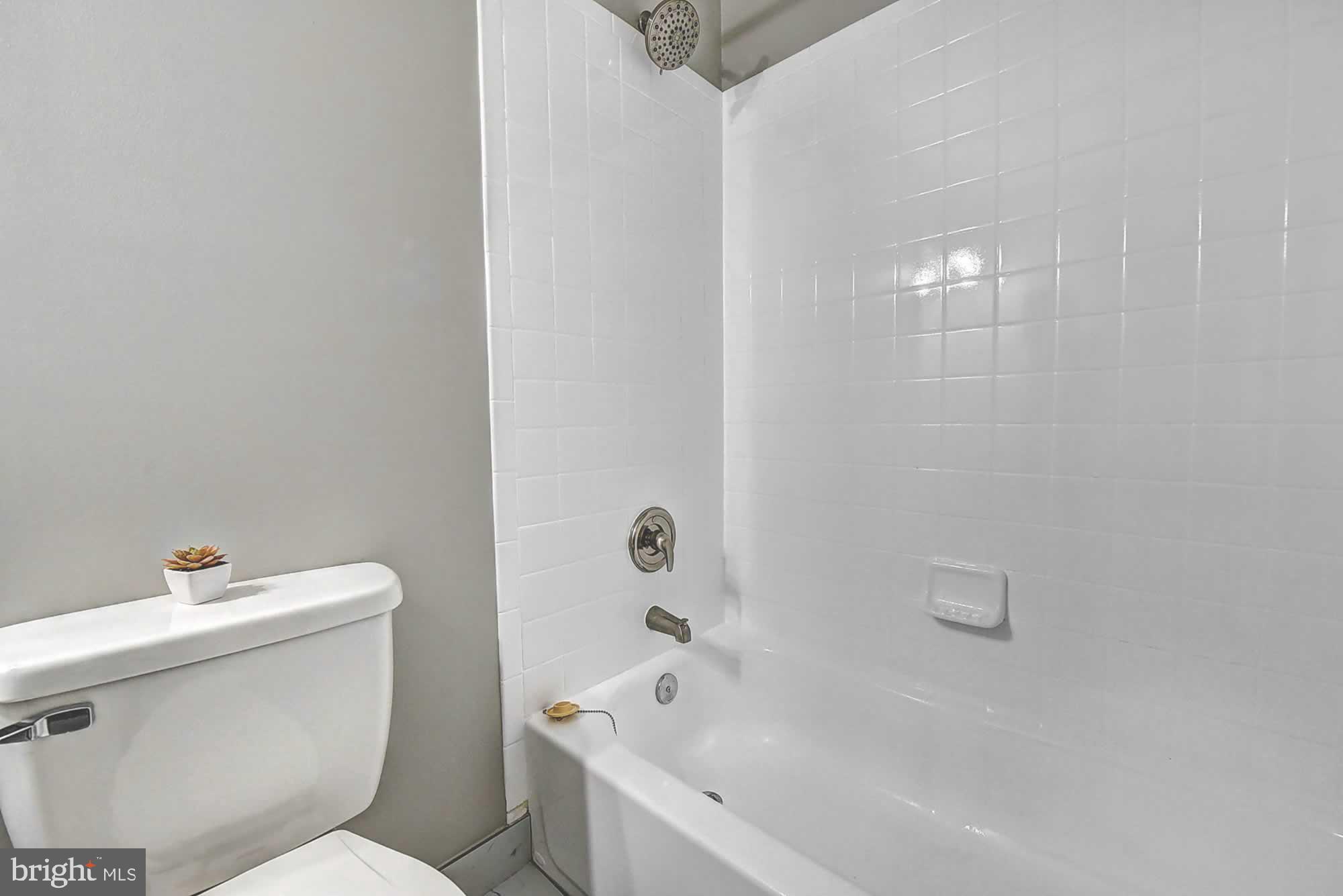 2226 Gunsmith Square Reston, VA 20191 - Photo 34 of 35 a white toilet sitting next to a bath tub
