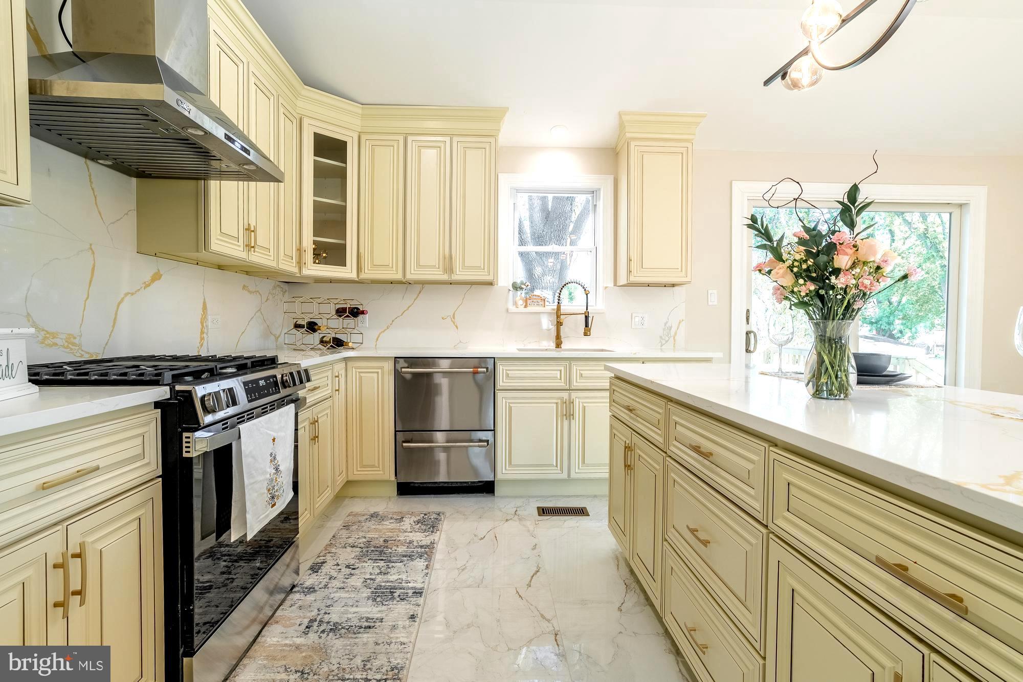 407 Bruce Terrace Cherry Hill, NJ 08034 - Photo 10 of 50 a kitchen with a sink stove and cabinets
