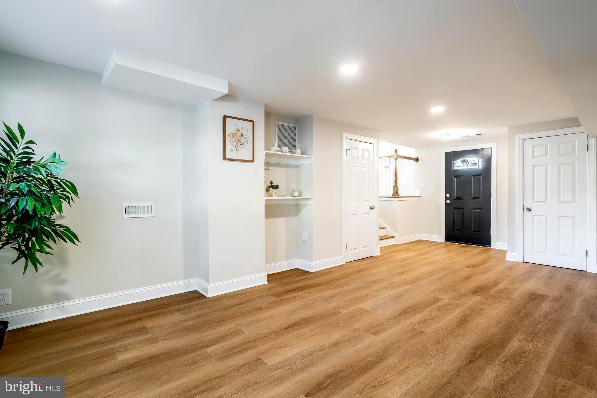 407 Bruce Terrace Cherry Hill, NJ 08034 - Photo 13 of 50 a large bedroom with a bed and a potted plant