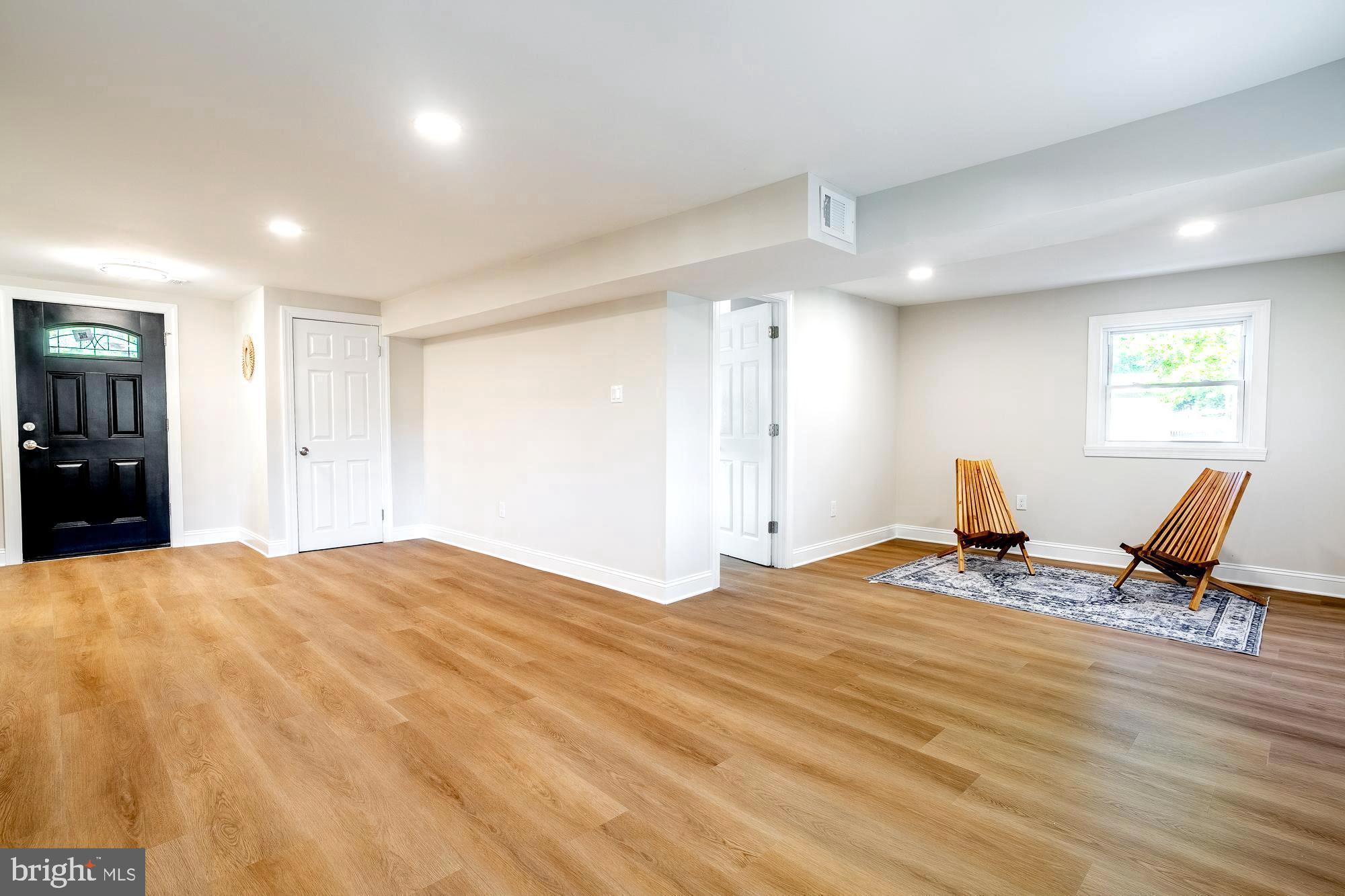 407 Bruce Terrace Cherry Hill, NJ 08034 - Photo 14 of 50 a workspace with wooden floor and furniture