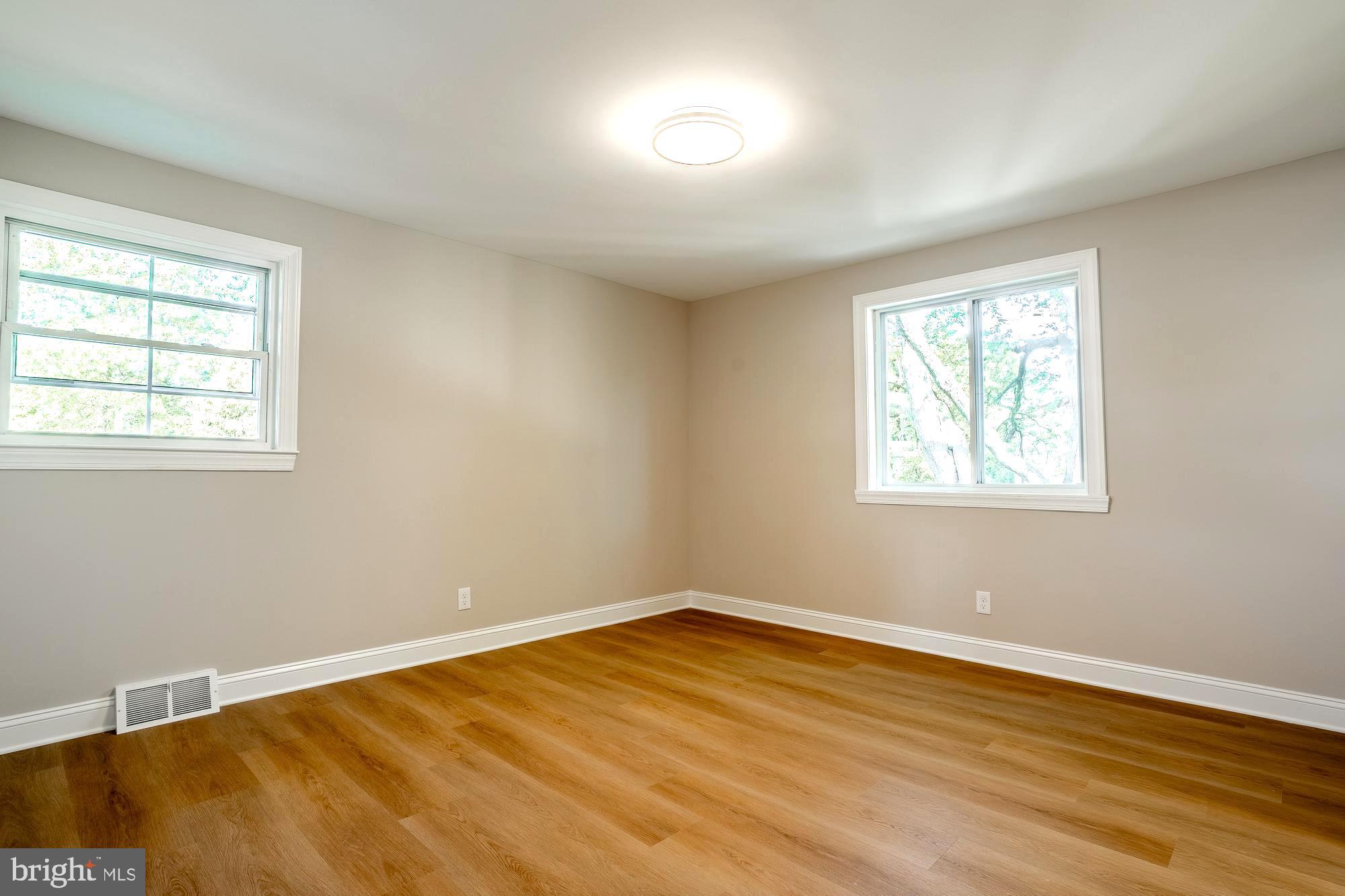 407 Bruce Terrace Cherry Hill, NJ 08034 - Photo 23 of 50 a view of a room with wooden floor and windows