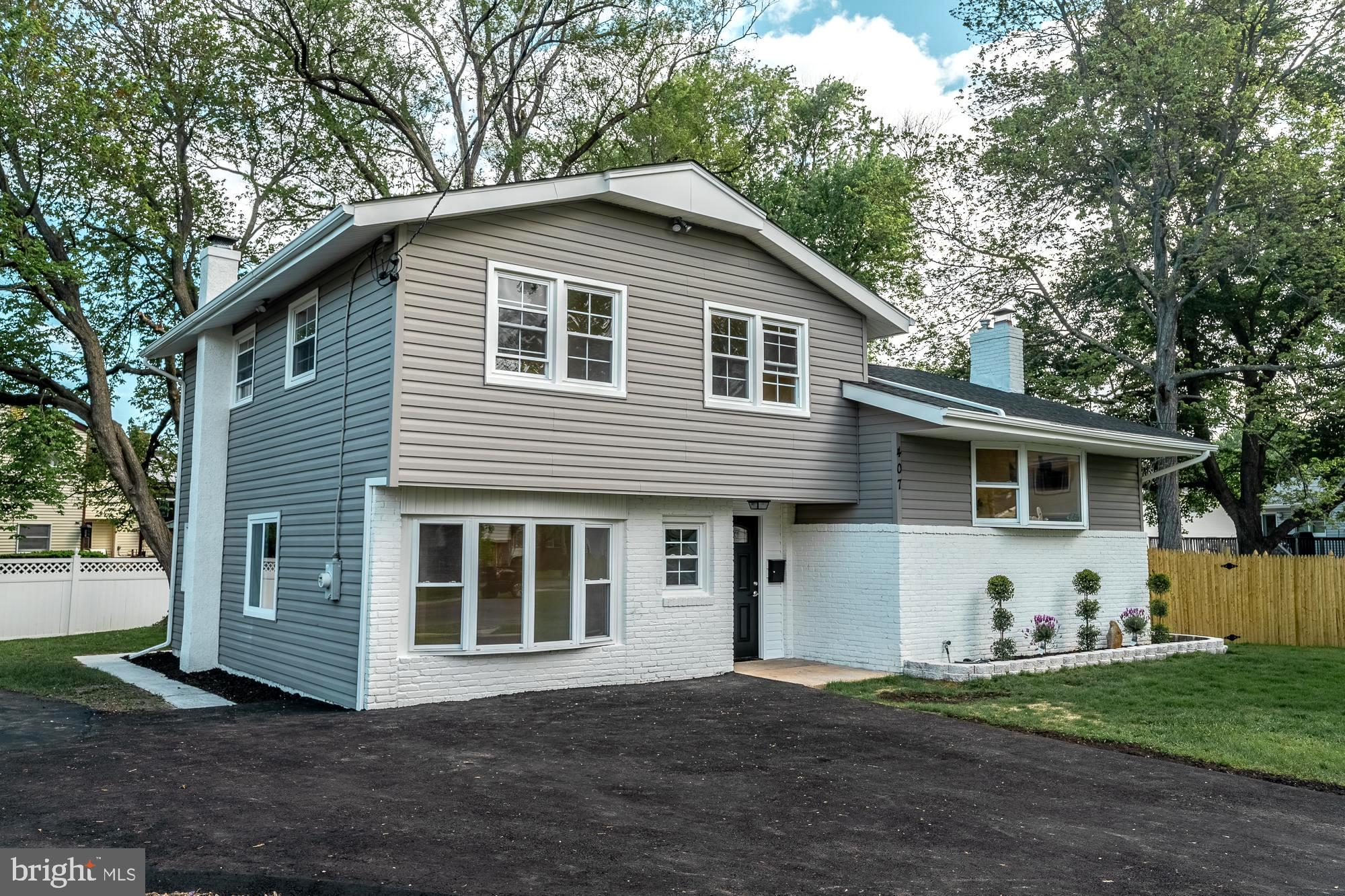407 Bruce Terrace Cherry Hill, NJ 08034 - Photo 3 of 50 a front view of a house with a yard