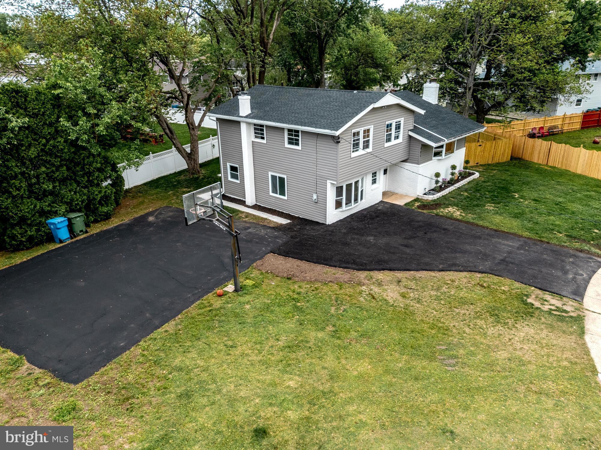 407 Bruce Terrace Cherry Hill, NJ 08034 - Photo 33 of 50 a front view of a house with a yard