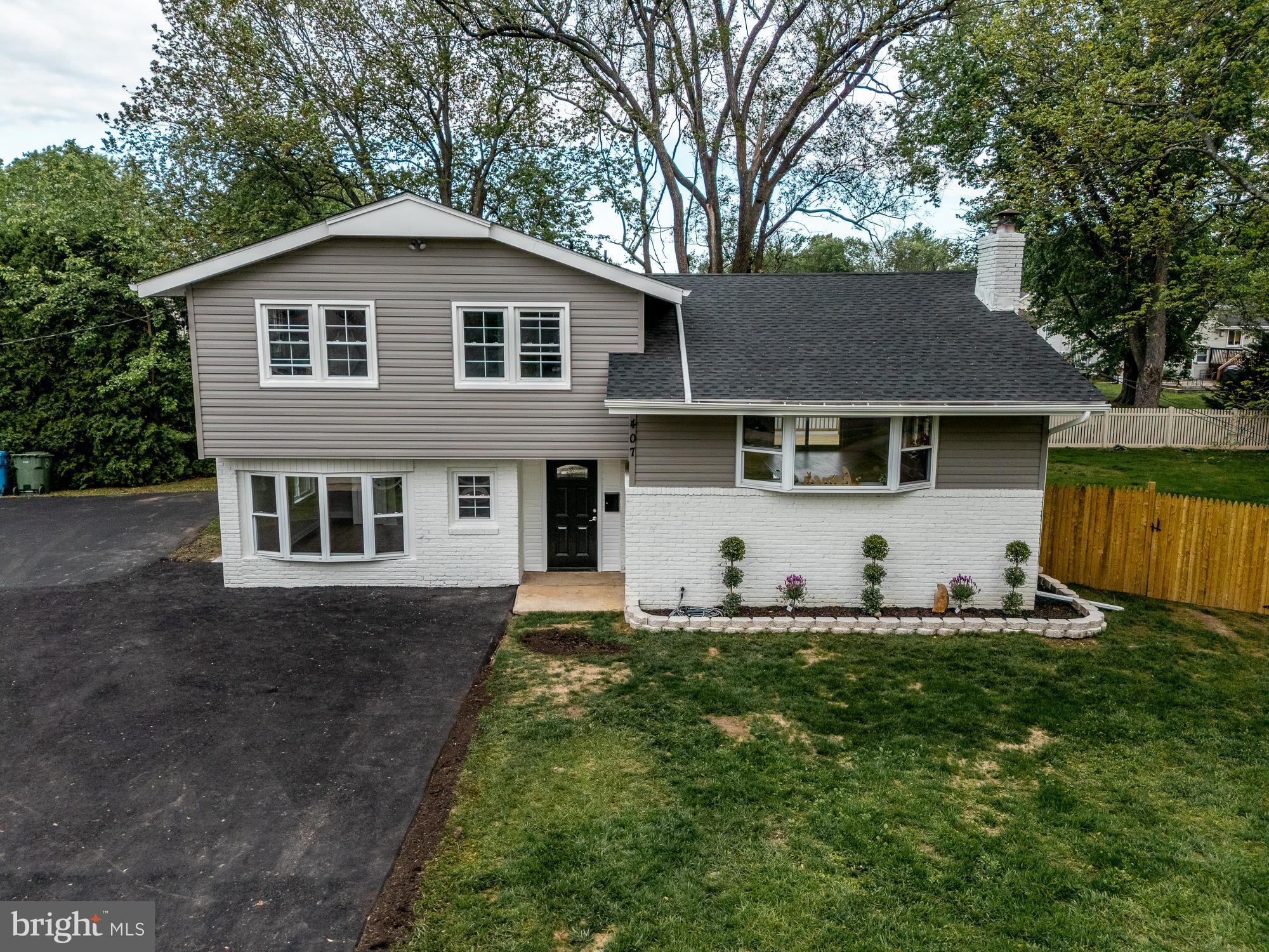 407 Bruce Terrace Cherry Hill, NJ 08034 - Photo 38 of 50 a front view of a house with a yard