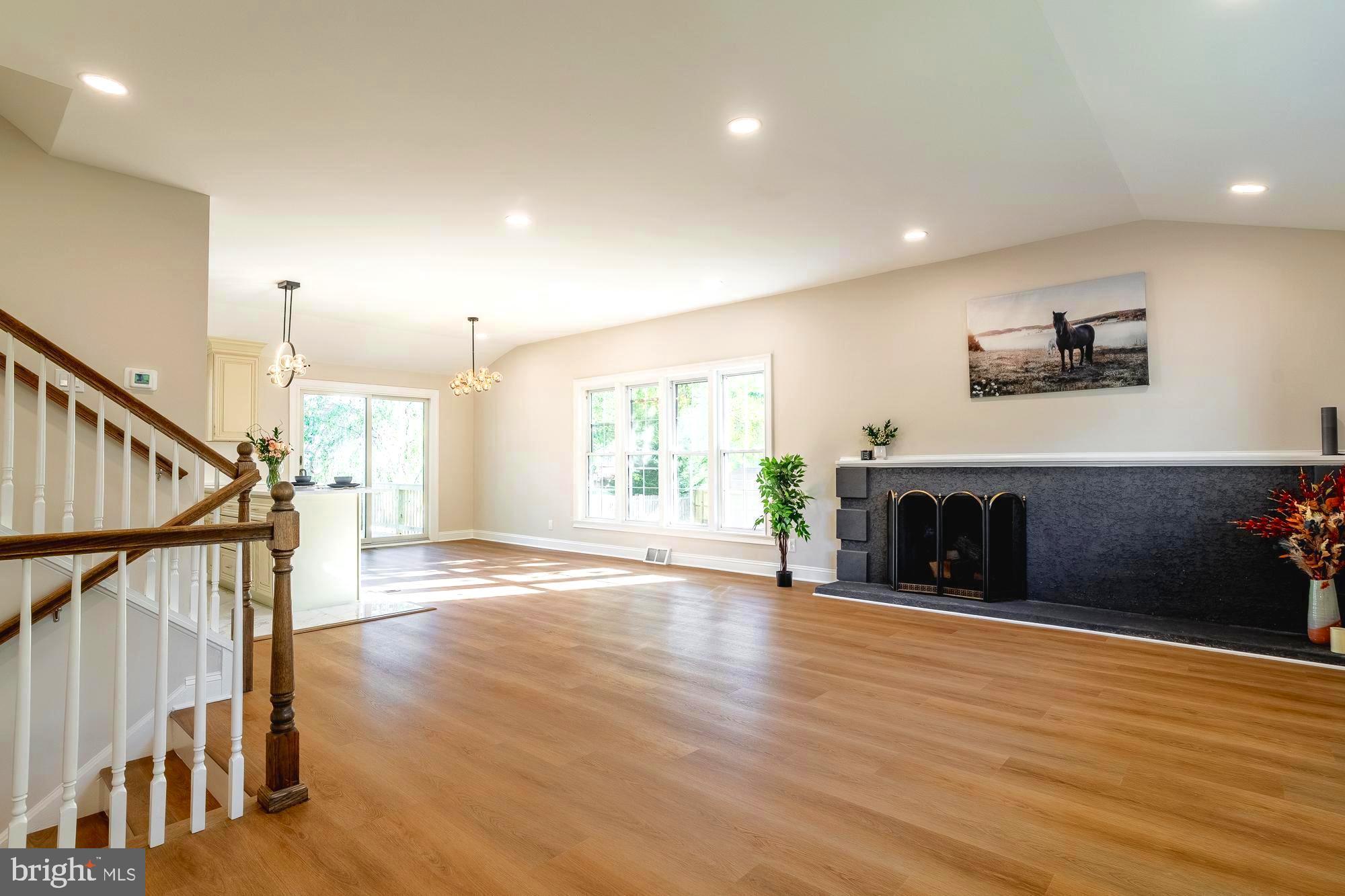 407 Bruce Terrace Cherry Hill, NJ 08034 - Photo 4 of 50 a view of an empty room with wooden floor and a fireplace