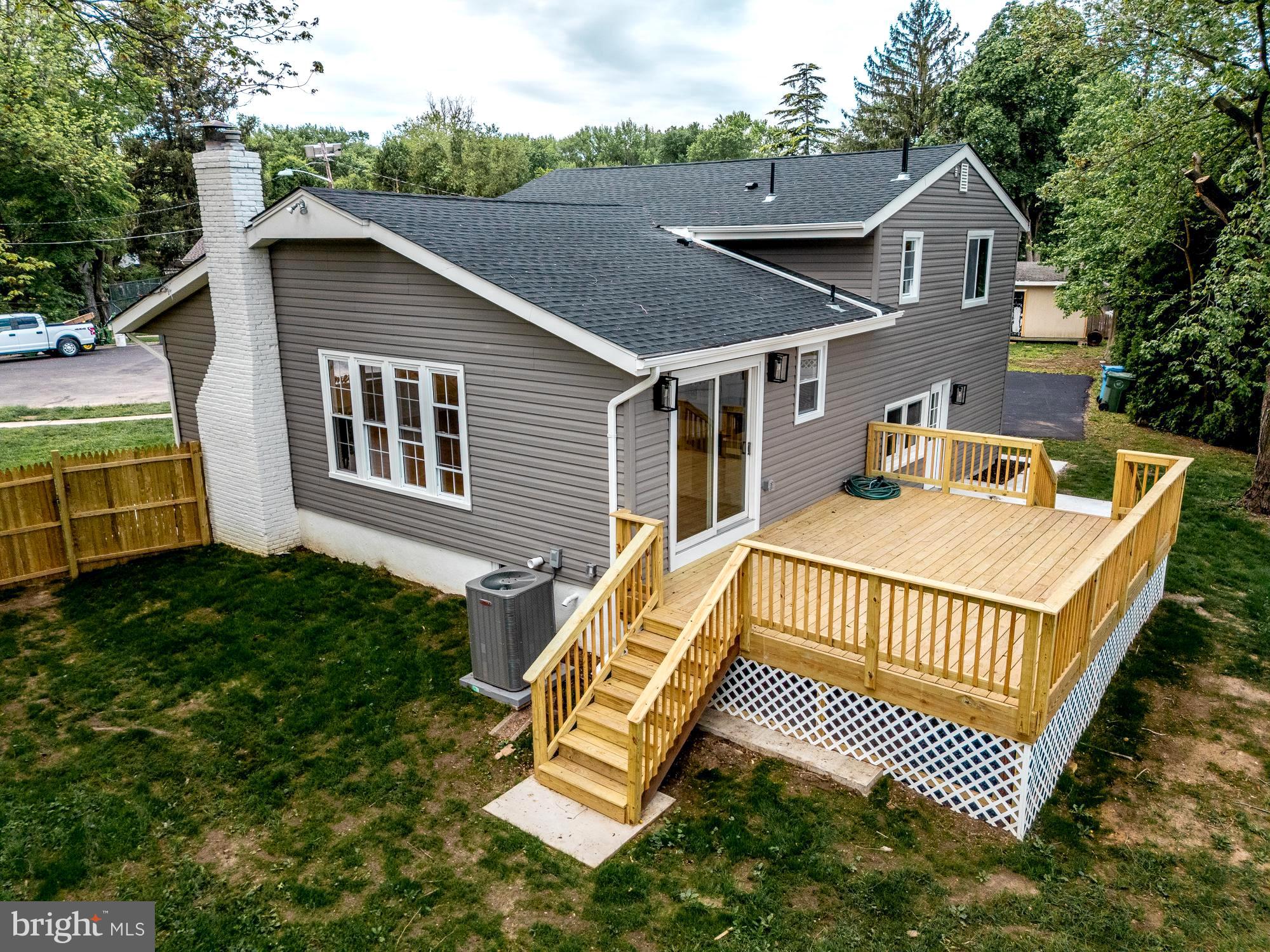 407 Bruce Terrace Cherry Hill, NJ 08034 - Photo 41 of 50 a view of a house with a yard and deck