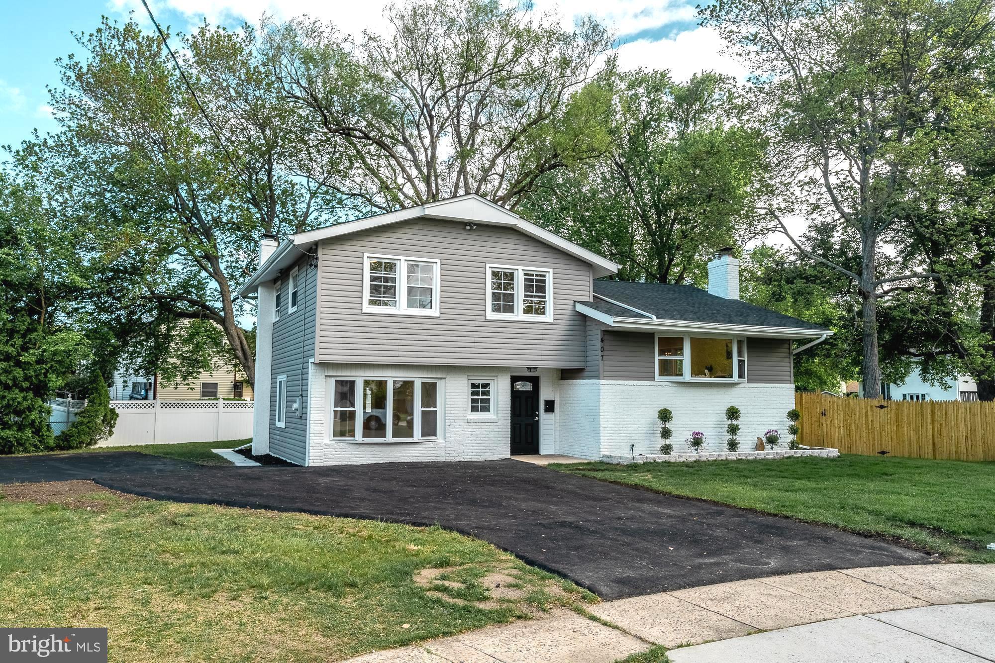 407 Bruce Terrace Cherry Hill, NJ 08034 - Photo 42 of 50 a front view of a house with garden
